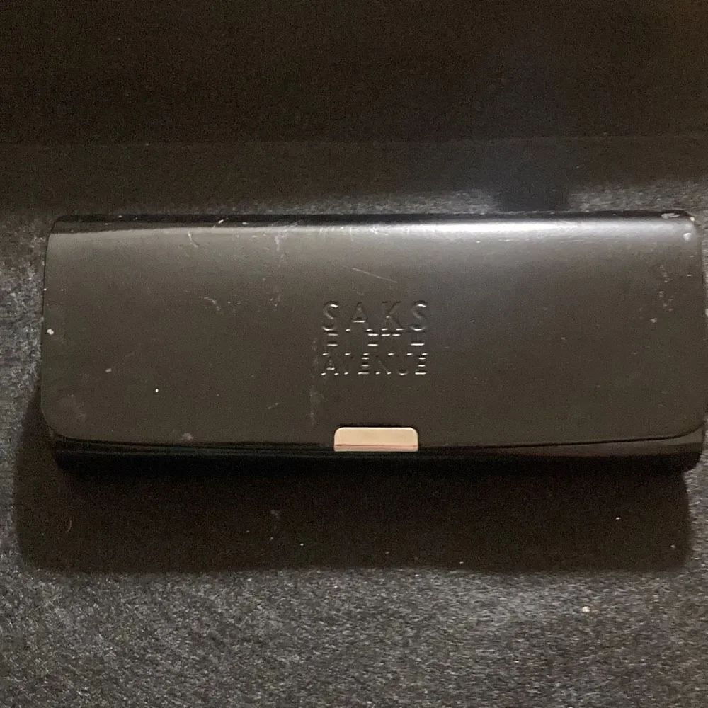 Glass case by sax fifth Avenue Scuff shown